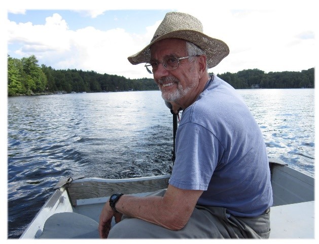 Dr.Murray Miller smiling on a boat 